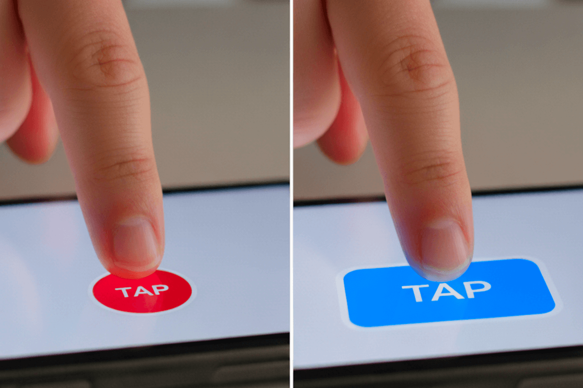 Finger on the left tapping a small red button. Finger on the right tapping a larger blue button