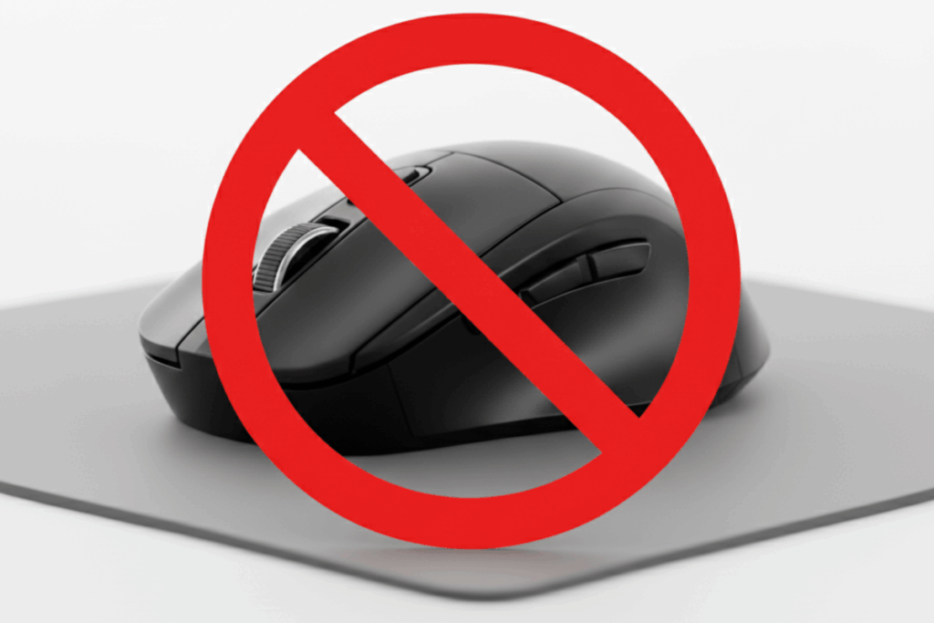 A black computer mouse with a red circle and a diagnal line in front of the mouse