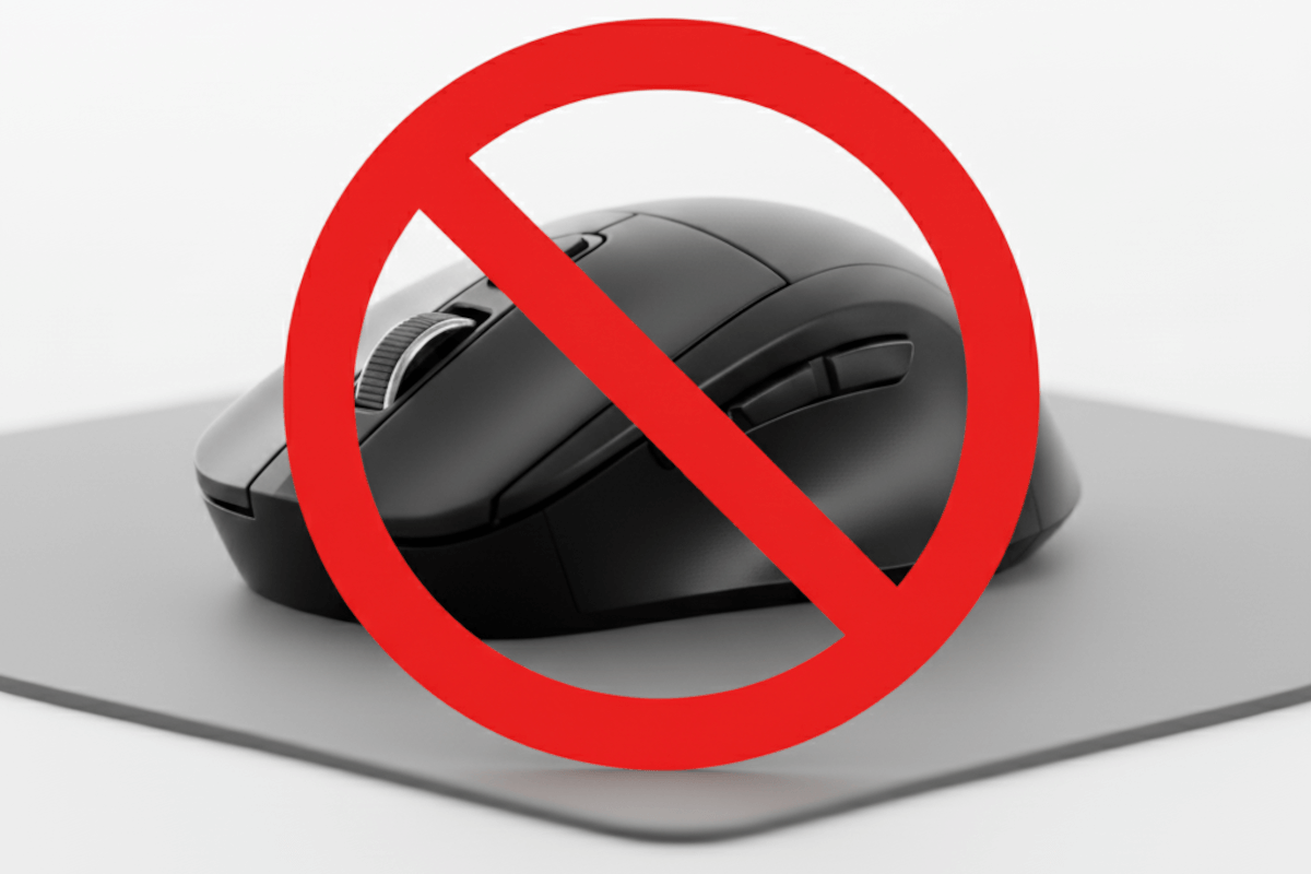 A black computer mouse with a red circle and a diagnal line in front of the mouse
